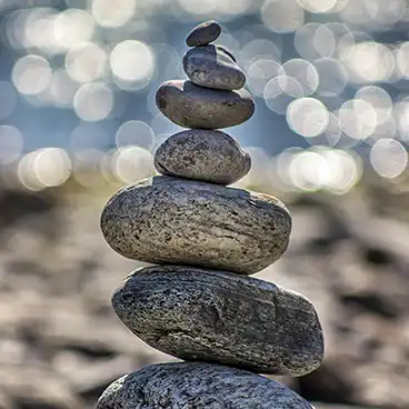 rock cairn by the water